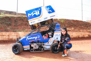 no smile sitting by car